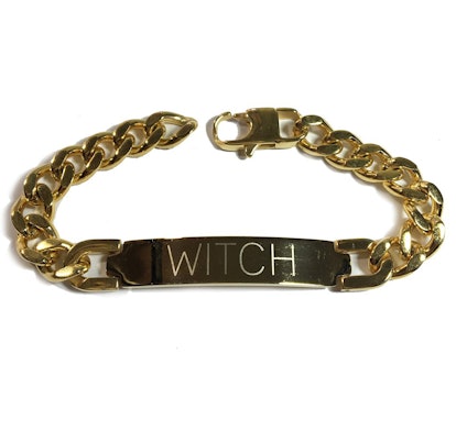 NYLONshop x Tawnie & Brina Collaboration, a gold bracelet with "Witch" engraved on it