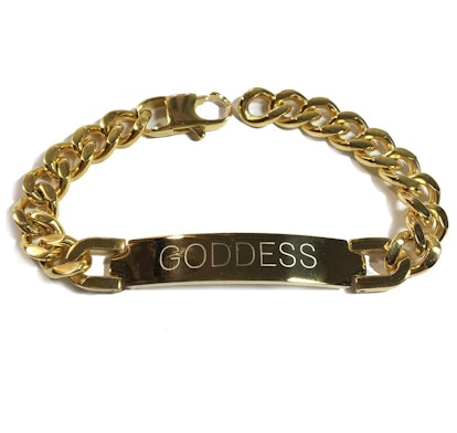NYLONshop x Tawnie & Brina Collaboration, a gold bracelet with "Goddess" engraved on it