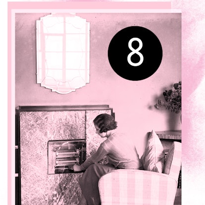 A woman sitting on an armchair next to a fireplace in her living room with "8" above her