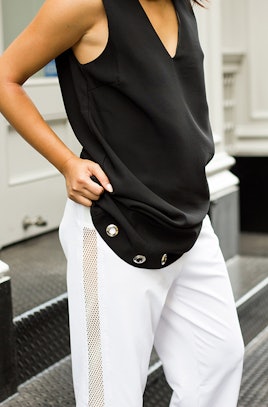 Close up of the black and white shirt and pants combination worn by a girl