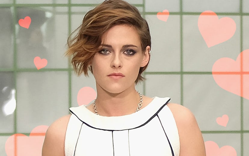 Kristen Stewart with short hair posing in a white and black dress