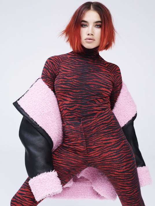 Isamaya Ffrench in an Kenzo x H&M outfit consisting of a cat print red body suit and a black leather...