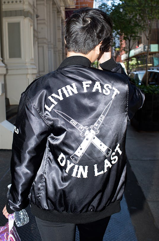 Lynn Kim in a black jacket with "Livin Fast Dyin Last" text