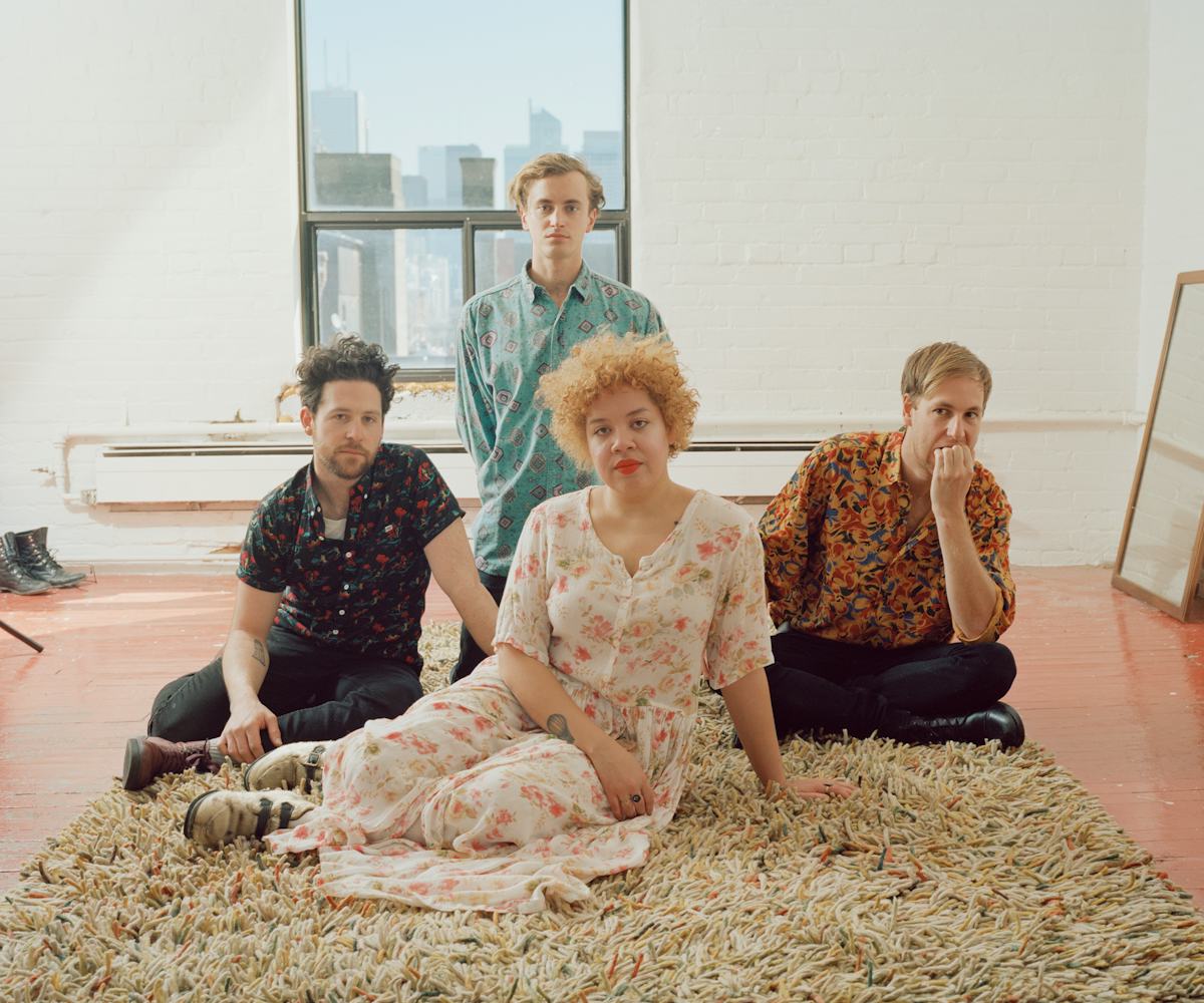 The Weaves members posing on a rug