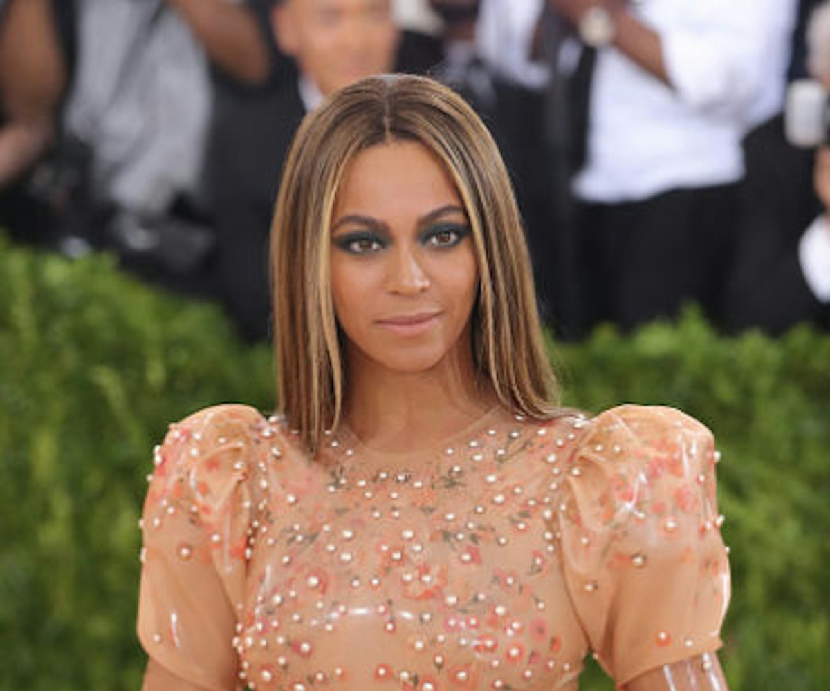 Beyoncé in a beige dress with sparkles on the red carpet