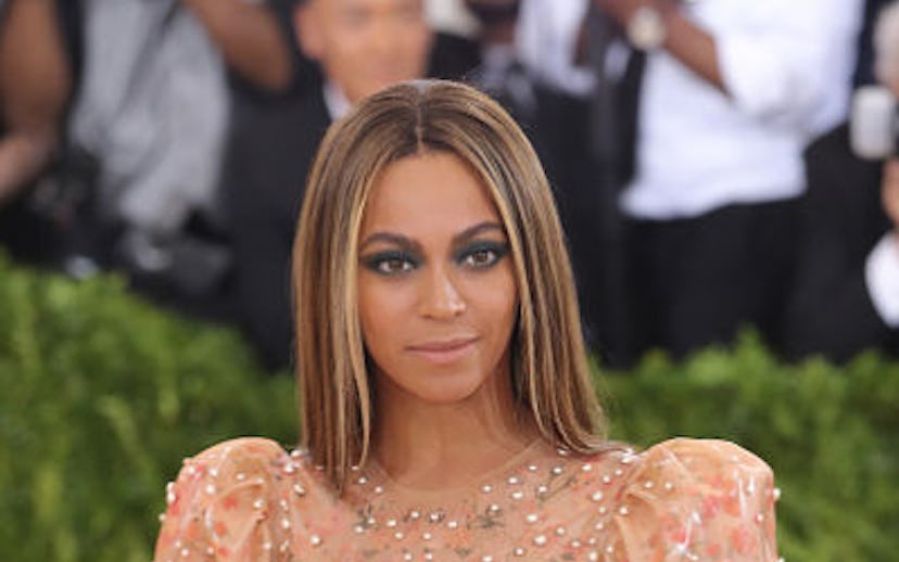 Beyoncé in a beige dress with sparkles on the red carpet