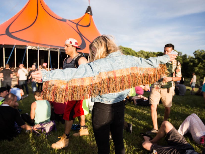 Mysteryland: A girl in a denim jacket with orange fringes