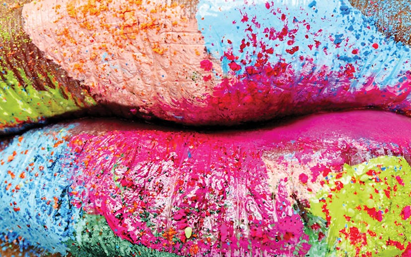 Lips painted in pastel hues including blue, yellow, pink, and green