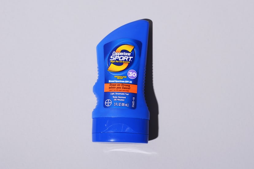 The Coppertone Sport sunscreen lotion in SPF 30 in blue packaging with a yellow logo 