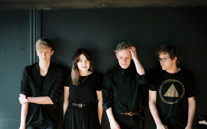 Yumi Zouma members posing for a photo while wearing all-black outfits