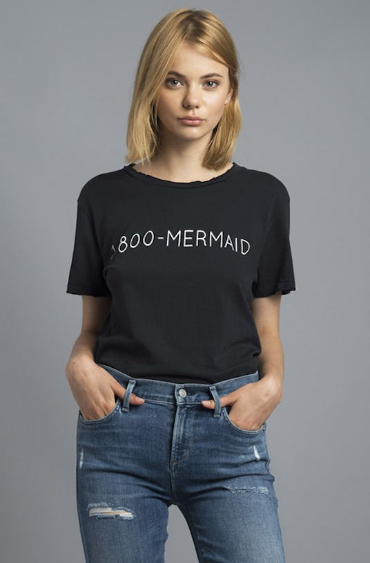 1-800-Mermaid Distressed Tee in black color worn by a blonde model