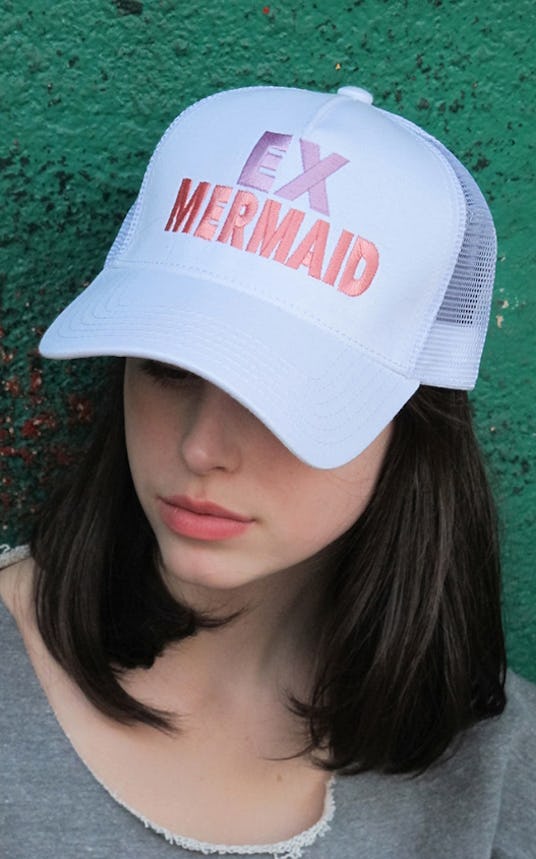 Ex Mermaids Trucker Hat in white color with pink text