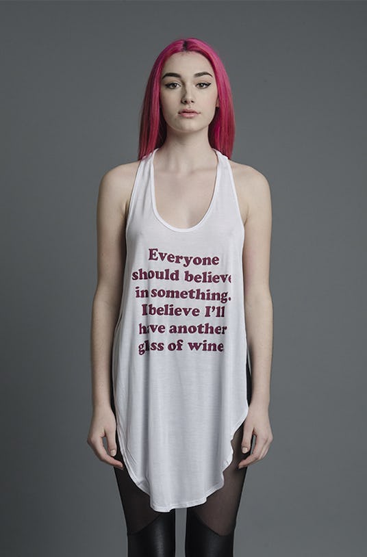 Woman in Jac Vanek, Believe in Wine Tulip Tank and black leggings