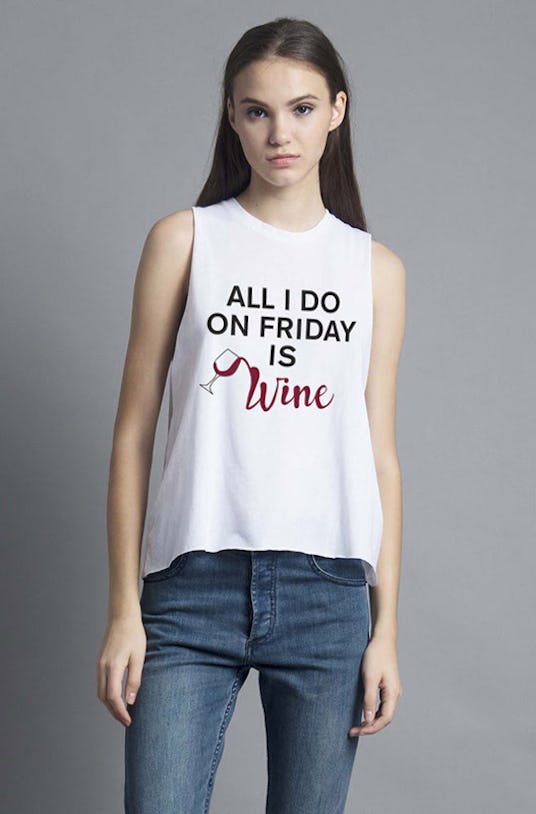 Woman in NYLON, Friday Wine Muscle Tank and blue jeans