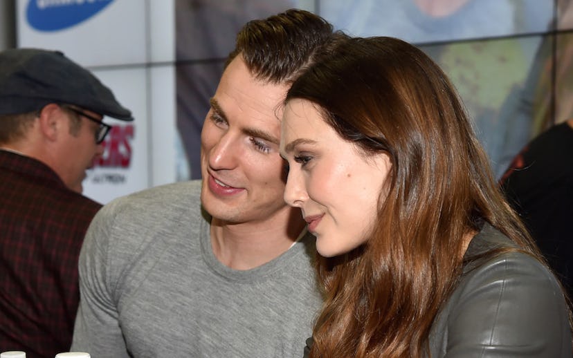Chris Evans And Elizabeth Olsen posing for a photo together