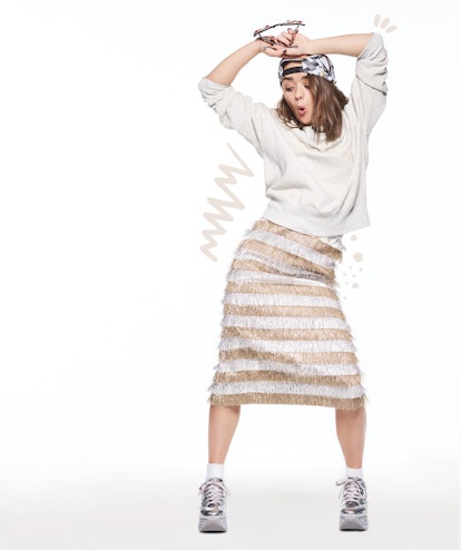 Maisie Williams dancing in a sweatshirt by Levi’s Vintage Clothing, skirt by Max Mara, sneakers by H...