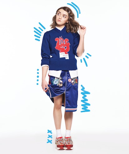Maisie Williams rocking blue in a sweater by Marc Jacobs, shirt by Noir Kei Ninomiya, skirt by Groun...