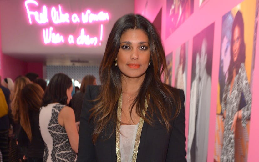 Rachel Roy wearing a beige dress and a black jacket with a gold collar