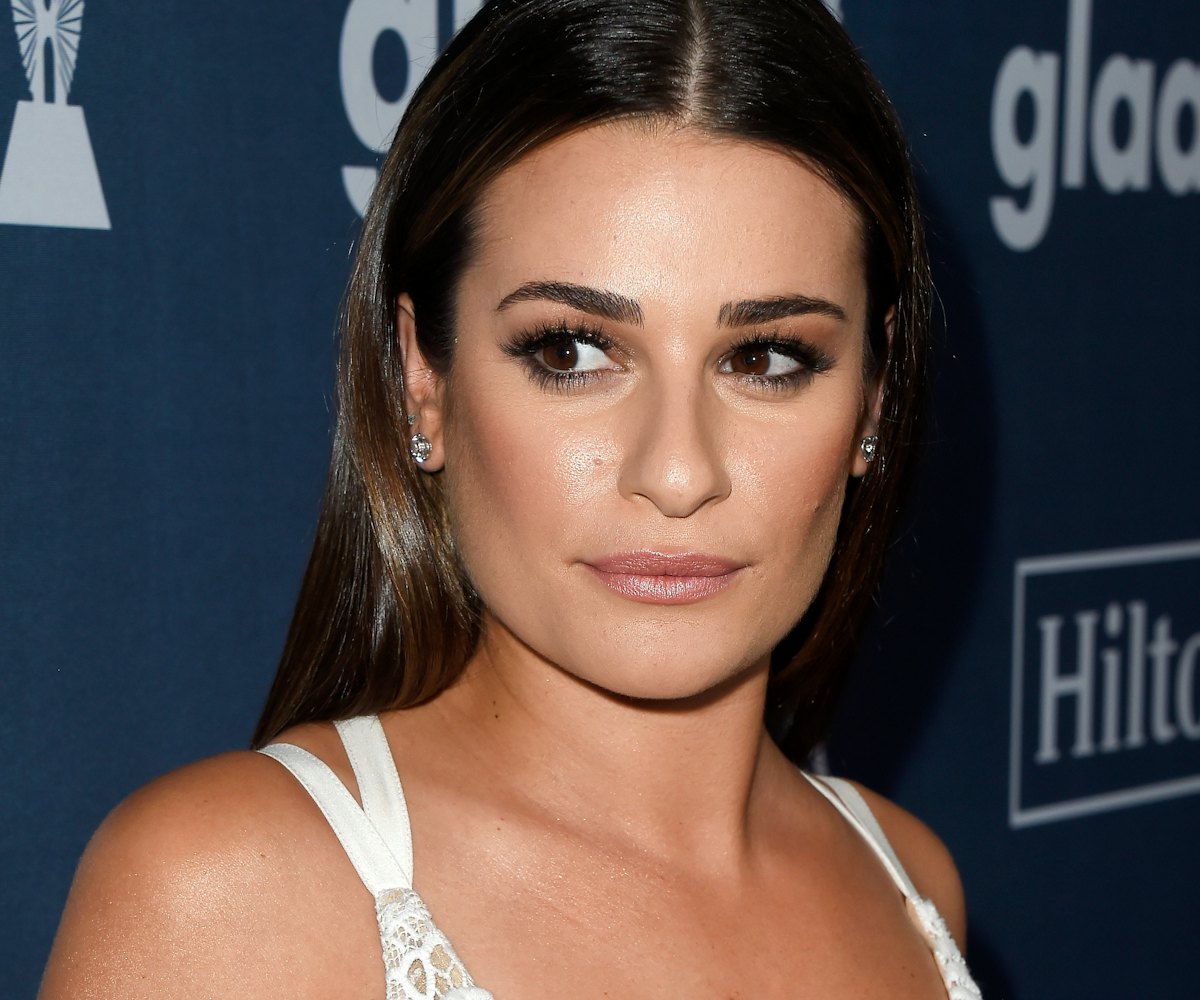 Lea Michelle wearing a white lace dress on The Red Carpet