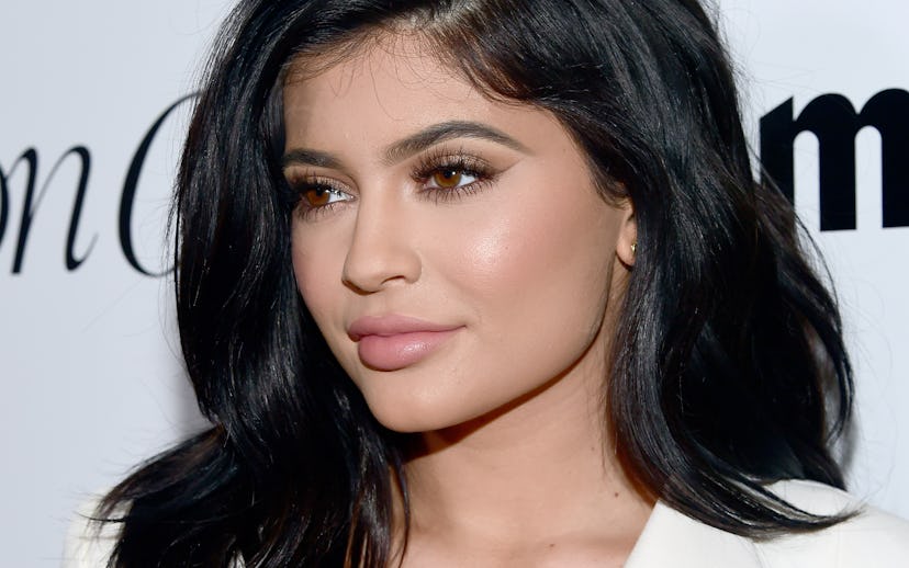 Kylie Jenner posing for a photo with a natural makeup look