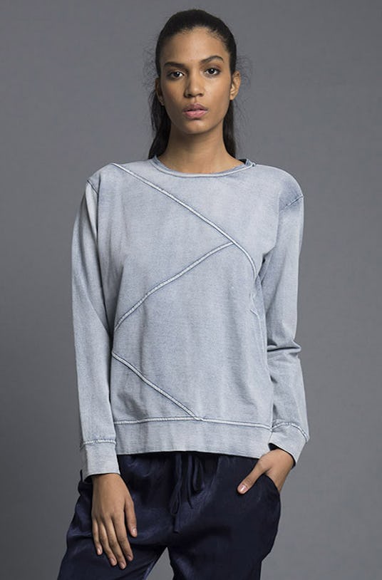 A woman wearing a grey sweater and black pants from Nana Judy’s Spring 2016 Collection