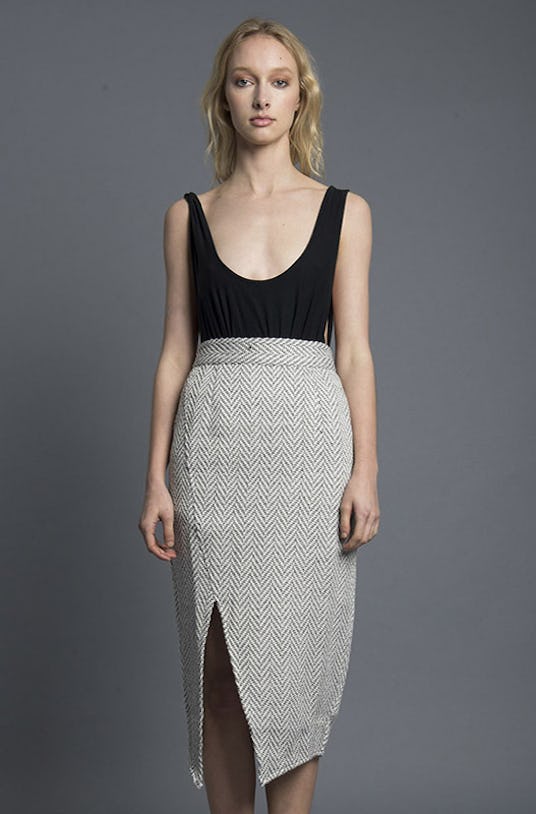 A blonde woman wearing a grey Jett Skirt and black tank top from Nana Judy’s Spring 2016 Collection