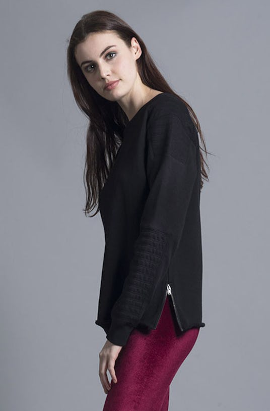 A brown-haired woman wearing a black Exposed Zipper Sweater from Nana Judy’s Spring 2016 Collection