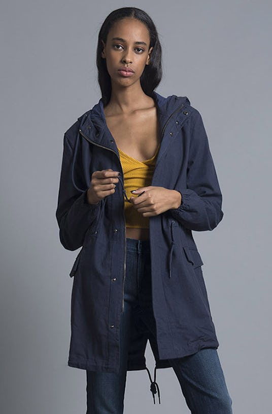 A black-haired woman wearing a blue Navy Parker Jacket from Nana Judy’s Spring 2016 Collection