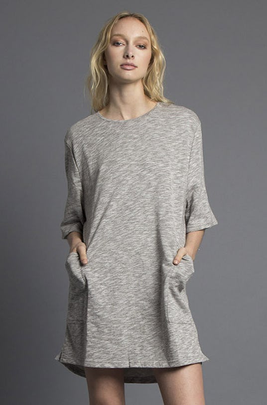 A blonde woman is wearing a grey Avalon Tee Dress from Nana Judy’s Spring 2016 Collection