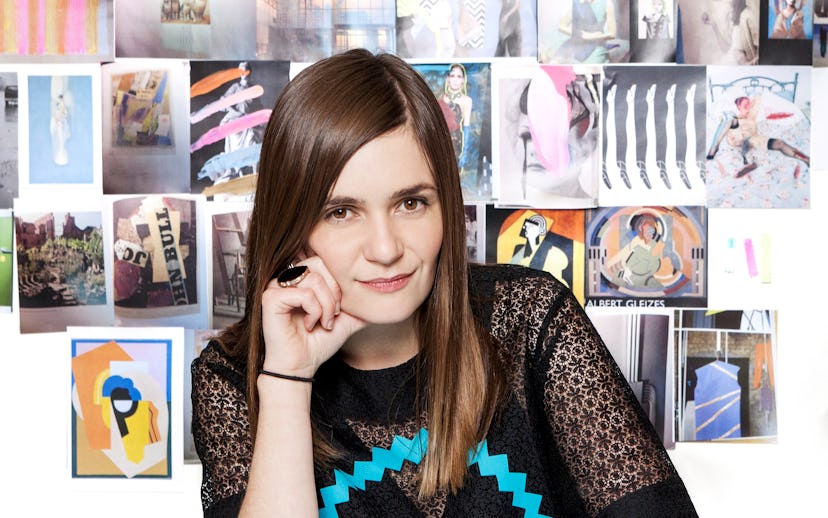 Danielle Romeril and a collage of her creations in the background