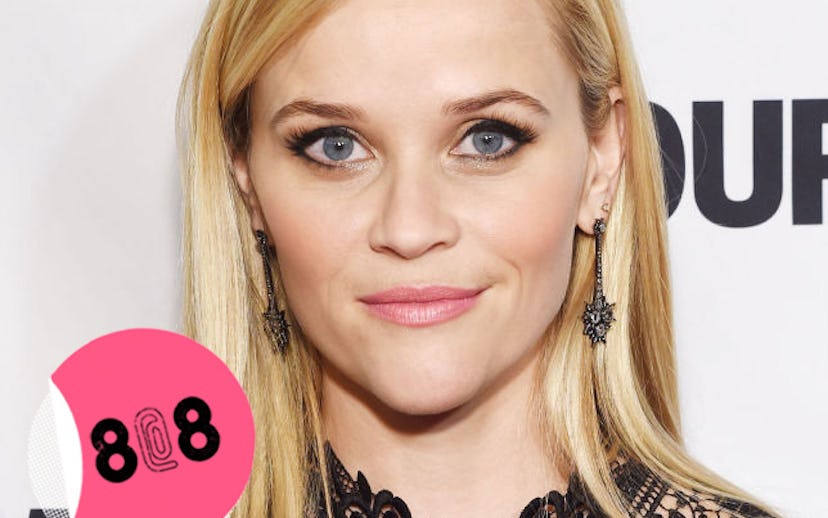Reese Witherspoon with her hair down and dangly earrings at a red carpet