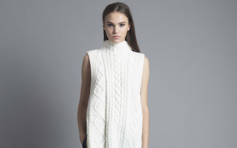 Woman with brown hair wearing a white Cable Knit Vest Dress