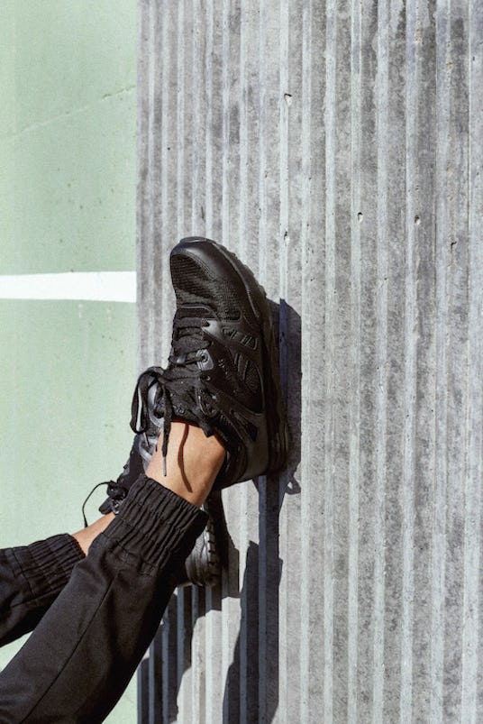 A model's feet in sneakers from Ari Fitz x Reebok Classic Collaboration Collection 