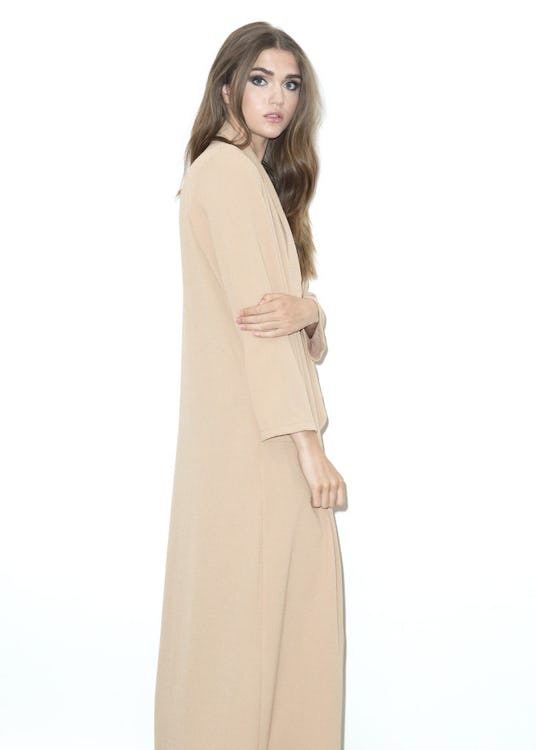 A model in Never Fully Dressed's camel maxi duster
