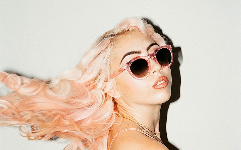 Model with pink hair wearing pink Crap Eyewear sunglasses