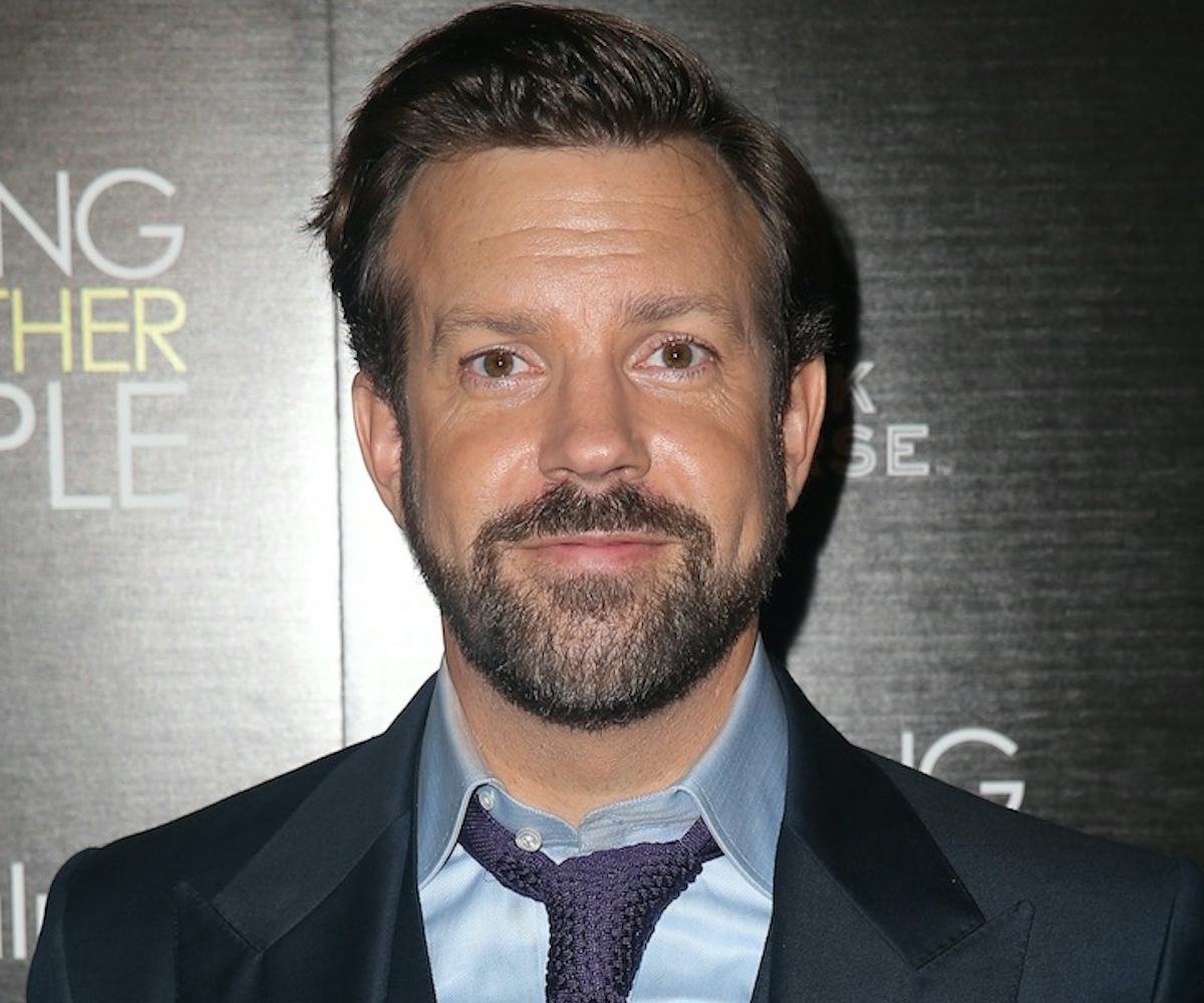 Jason Sudeikis posing for a photo in a suit