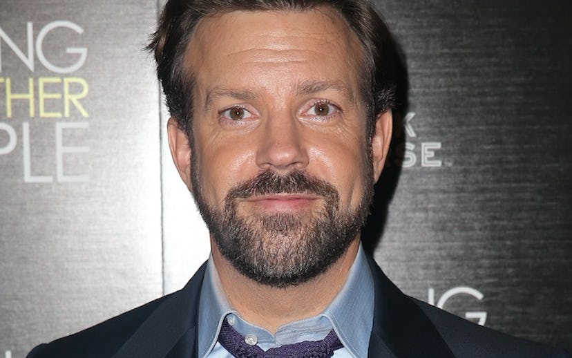 Jason Sudeikis posing for a photo in a suit
