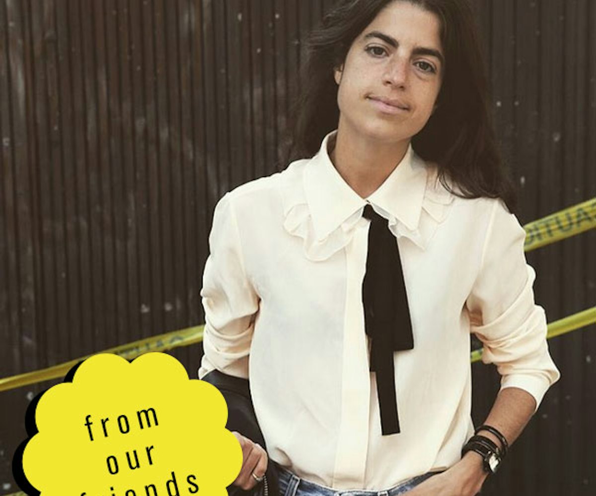 Leandra Medine in a ruffled white button-down and jeans, rocking a natural look