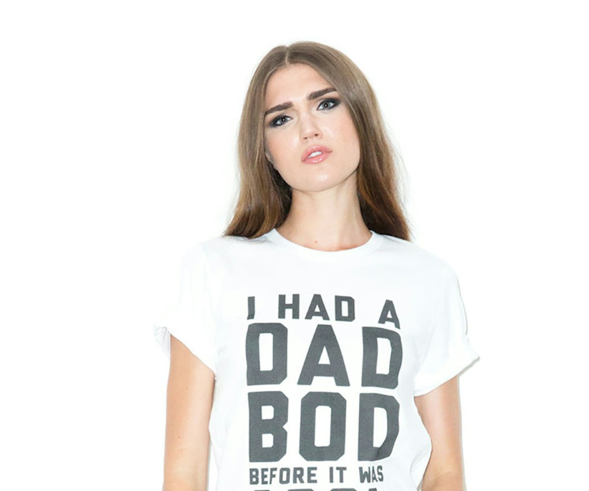 A girl wearing an "I had a dad bod before it was cool" shirt