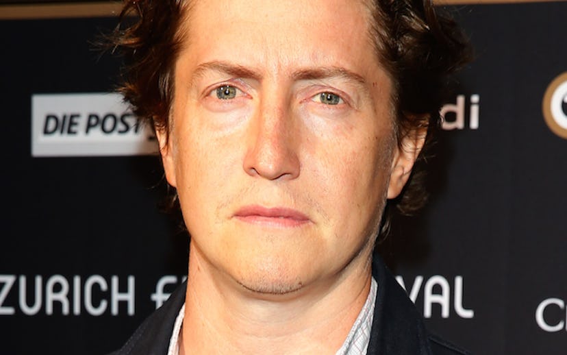 David Gordon Green wearing a white shirt and black jacket, looking in the camera 