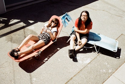 Bethany Cosentino and Bobb Bruno resting outside in their lounge chairs