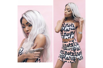 Nyané posing against a pink wall in the NYLON x Motel Rocks abstract crop top and cut-out skirt two-...