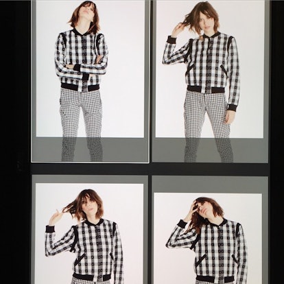 Collage of four photos of a female model posing in a black and white plaid bomber jacket