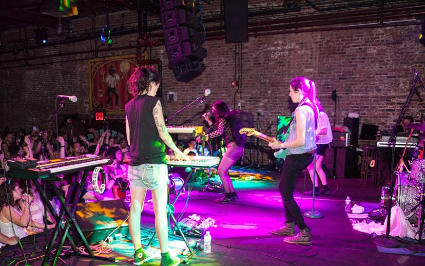 Artists performing in front of a crowd at the Nylon music tour