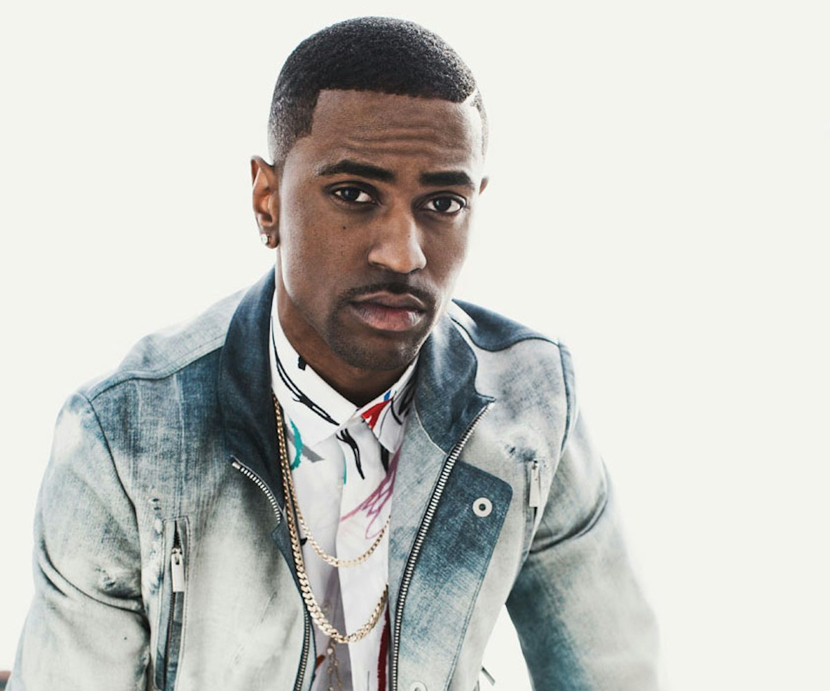Singer Big Sean wearing a blue and white denim jacket talking about his Rags to Riches story