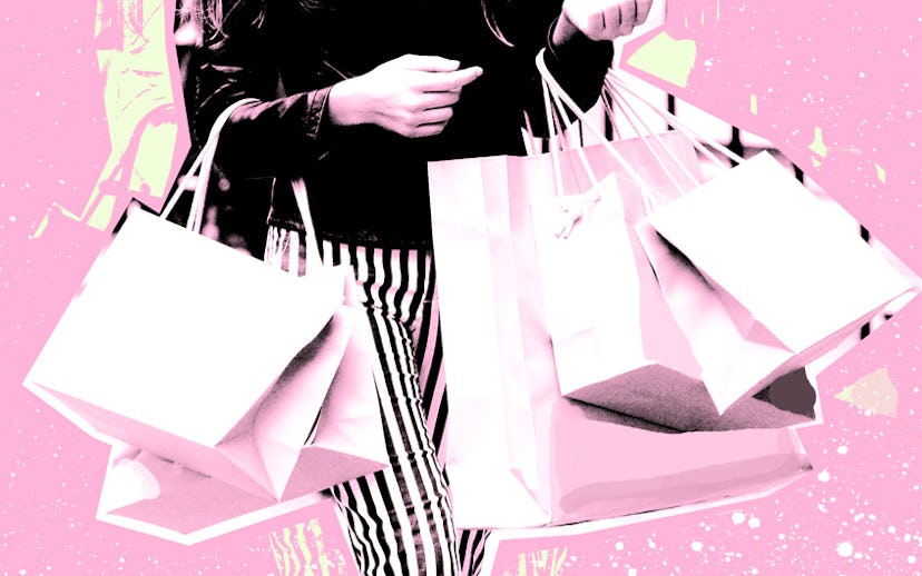 Girl with a lot of store bags in pink and black colors
