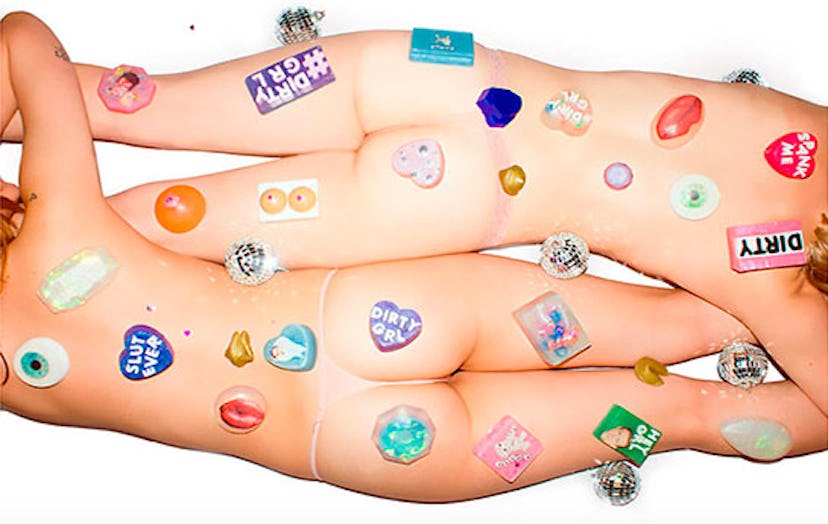 Two half naked bodies covered with stickers presenting DIRTY GRL brand