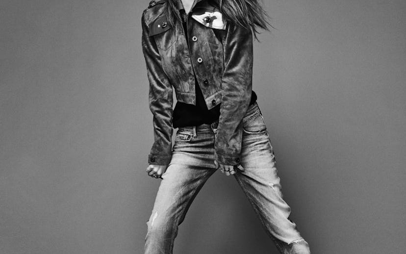 Anna Kendrick posing in a denim jacket and jeans