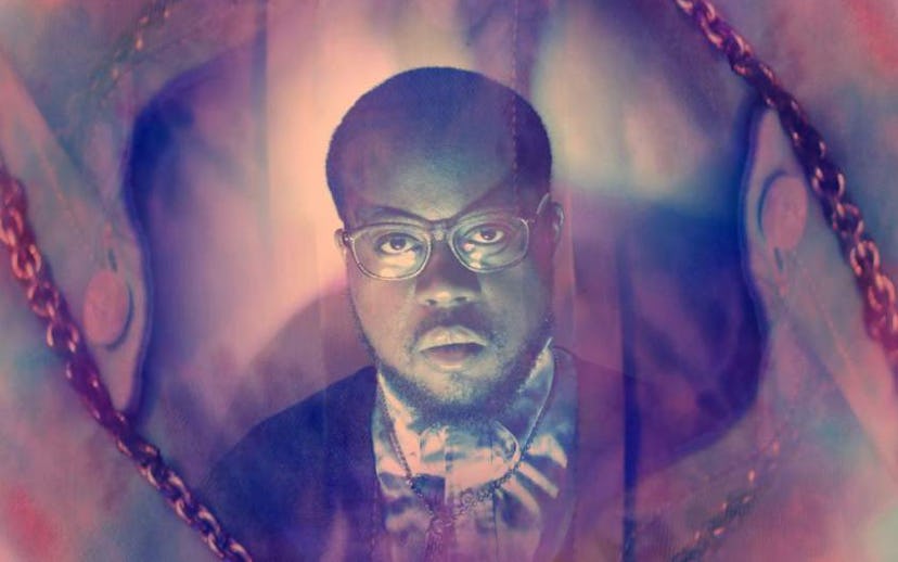 Picture of serious Daniel Wilson on a warm-color background