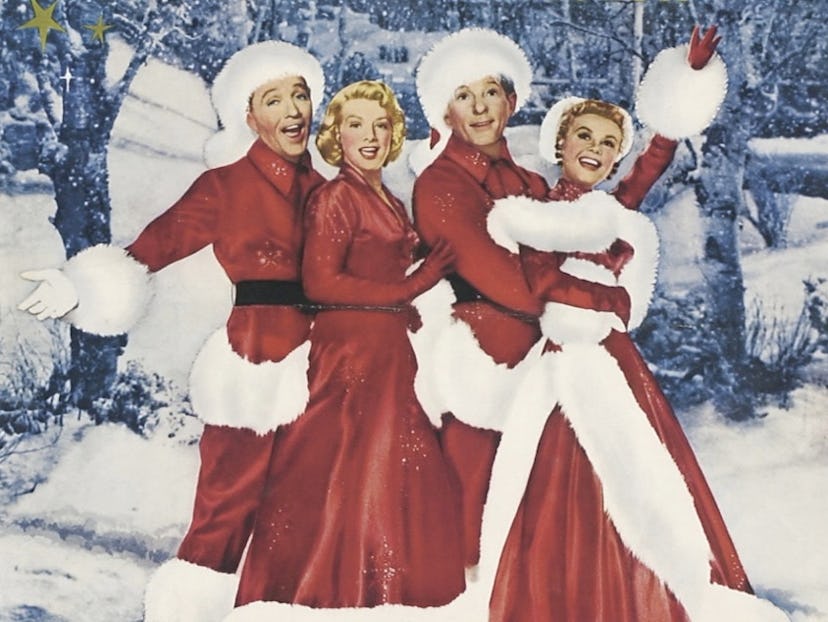The poster of "White Christmas (1954)" with the main actors dressed in Santa costumes